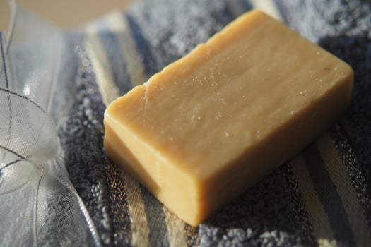 Handmade soap on a textured towel in natural light photo