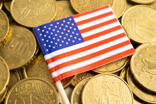 US America flag on coin and banknote money, finance trading investment currency. photo