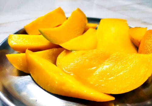 Sliced Ripe Mango in Steel Plate photo