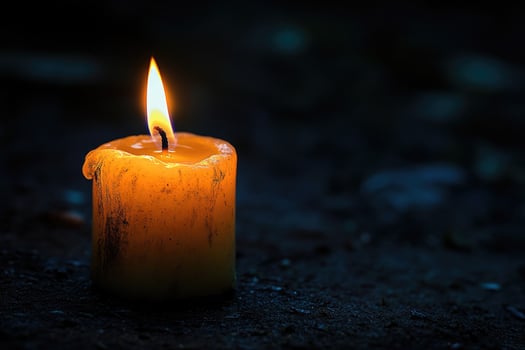Burning candle providing light in darkness, melting wax, hope and remembrance photo