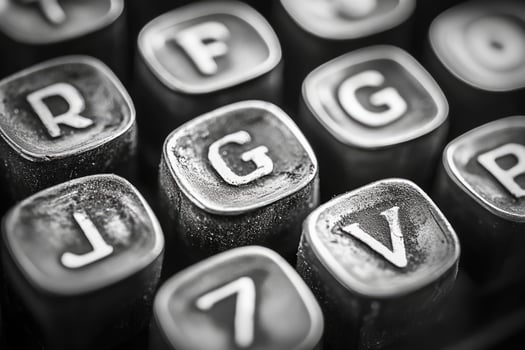 Close-up view of dusty typewriter keys showing signs of wear and tear photo