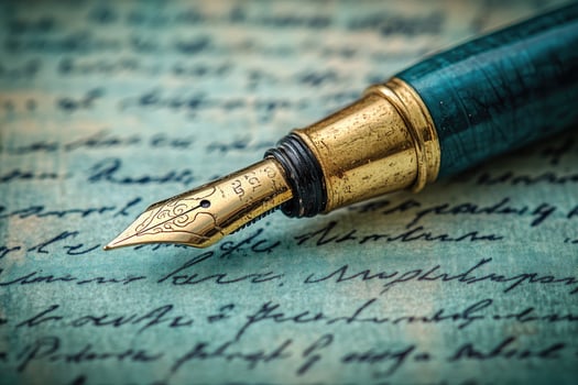 Elegant fountain pen lying on vintage handwritten letter photo