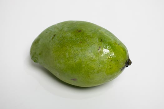 Fresh mango on white surface photo