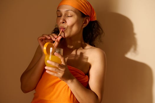 Woman Enjoying Fresh Orange Juice in a Relaxed Atmosphere photo