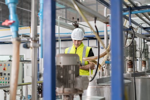 Engineers or factory managers wearing safety helmet inspect the machines in the production line. Utility inspector check machine and test the system to meet the standard. machine. maintenance. photo