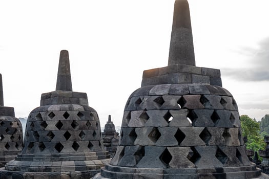 Stone Carved Stupa Borobudur Structure with Diamond Pattern and Towering Spire photo
