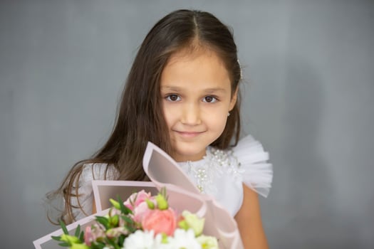 Portrait of a beautiful little indian girl with flowers photo