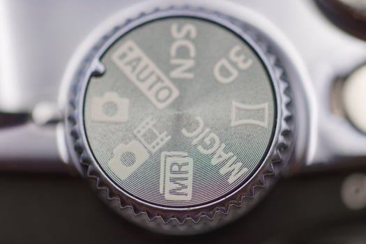 Settings dial on a camera showing various modes during a photography session photo