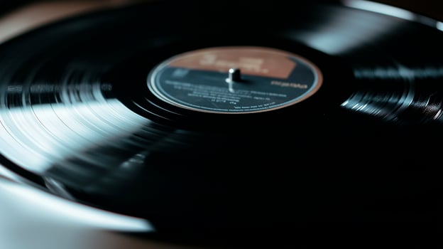 A black vinyl record sitting on top of a table photo