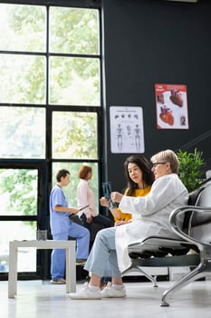 Patient discussing x-rays with doctor photo