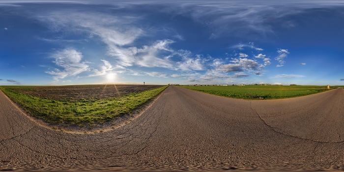 360 panorama of a road in the middle of a field photo