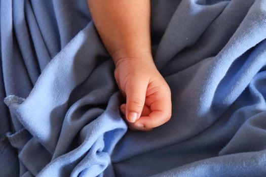 Adorable baby hand macro photo