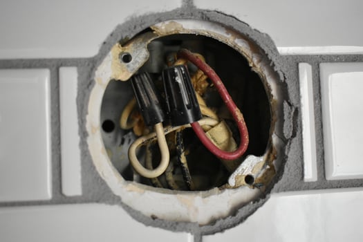 Old Wire Nuts on Electrical Wires, Wall Lamp Installation on a Tile Backsplash photo
