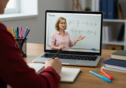 A woman is teaching on a laptop screen photo