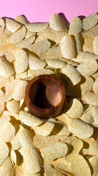 Empty Dip Bowl Surrounded by Potato Chips photo