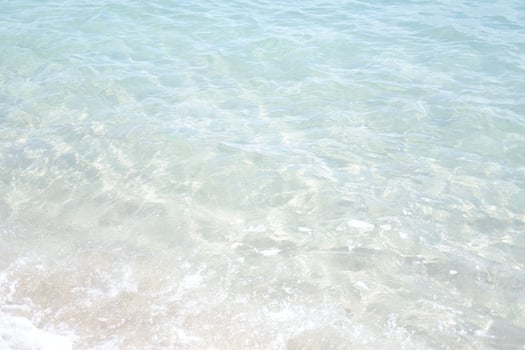 Gentle Waves Washing Over White Sand photo