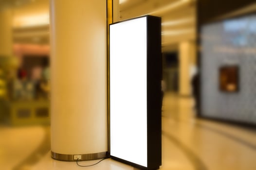 A large white billboard is sitting on the floor photo