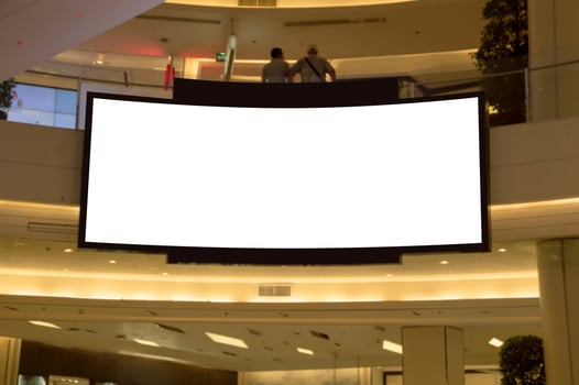 A large white screen in a mall photo