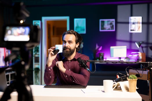 Man in stylish studio with camera photo