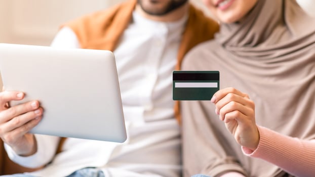 Couple using tablet for online shopping photo
