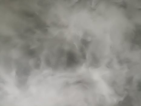 Grey smoke and white fog form an abstract background texture. dark atmosphere feels ethereal with swirling pattern of mysterious steam and misty vapor effect photo