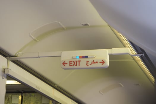 Sign indicating exit on an aircraft during flight photo
