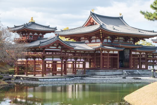 Byodo-in Temple Uji Kyoto Japan, Historic Japanese temple by a serene pond surrounded by nature. photo