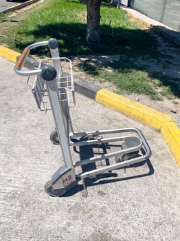 Unused Shopping Cart on Sidewalk photo
