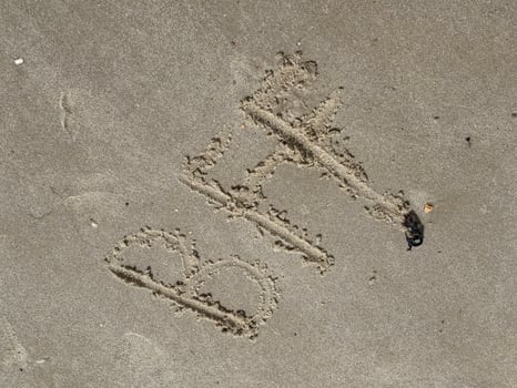 A childs hand has written BFF best friends forever in the sand at the beach of the North Sea coast photo