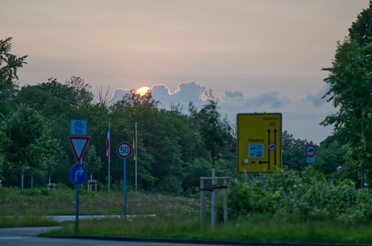 The sun sets behind a large cloudscape at the German-Danish border in Krusau photo