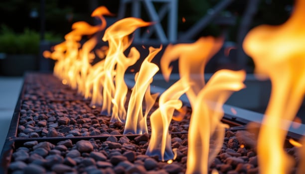 close up view of synchronized flames moving in rhythm in a fire feature installation. photo