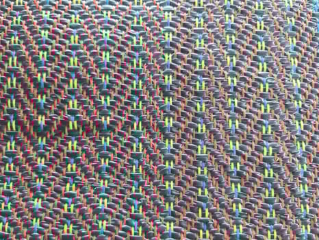Colorful beads form an abstract, textured pattern, creating a vibrant textile design for a unique backdrop photo
