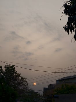 Golden hour sunset view with cloudy sky and urban landscape photography and nature aesthetic scene capture photo