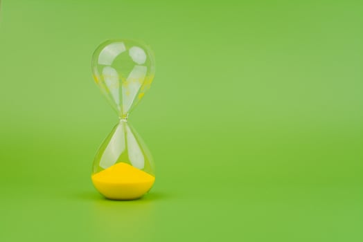 Hourglass High quality photography concept of time and effective time management. photo