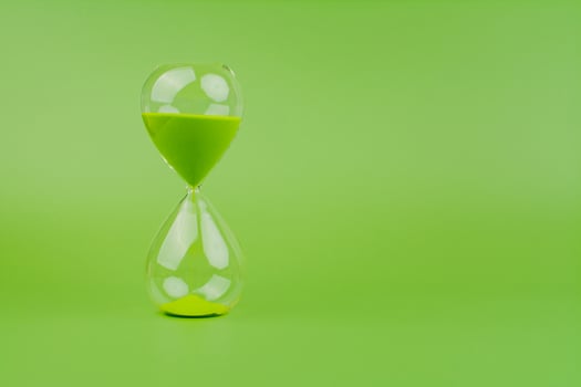 Hourglass High quality photography concept of time and effective time management photo