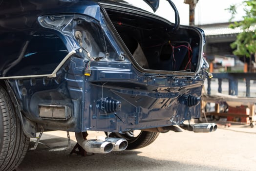 A car with its rear bumper and exhaust pipes photo