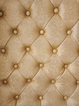 Luxury brown leather upholstery with buttons, closeup photo