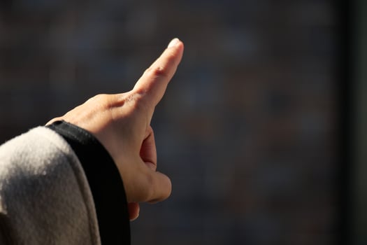 Hand gesturing to emphasize a point outdoors photo