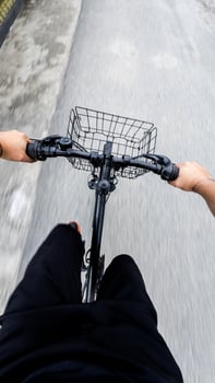 First-Person View of Cyclist Riding Bike on Road photo