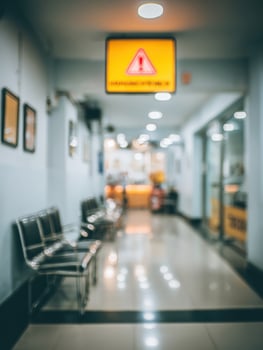 Blurred Hospital Waiting Room With Cold Warning Signage and Open Left Side Contributing to an Unsettling Atmosphere During Visitor Hours photo