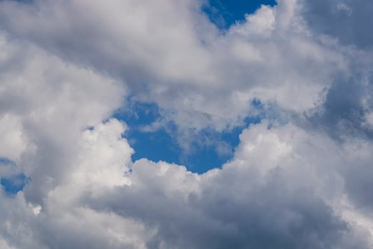 beautiful picture of clouds cumulus clouds, with a gap to the blue sky photo