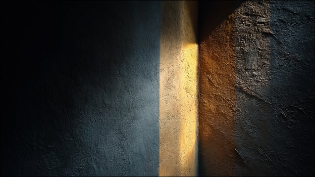 Dramatic interplay of light and shadow on a textured wall creates an abstract composition photo
