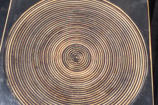 Wooden black board with multiple circle shapes. photo