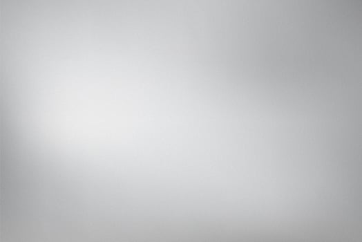 Subtle gradient of light grey with fine grain texture photo