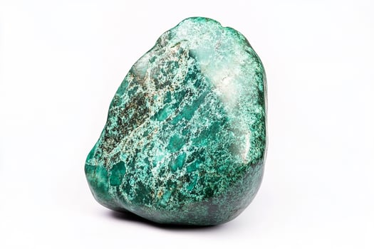 Close up shot of a polished malachite stone with green and black patterns on a white background photo