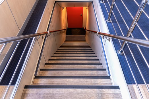 Stairs leading down on the ferry. Exit outside. photo