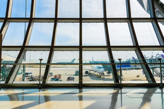 Airport terminal glass window with view of airplane, airport interoir departure hall for travel and transportation concept. photo
