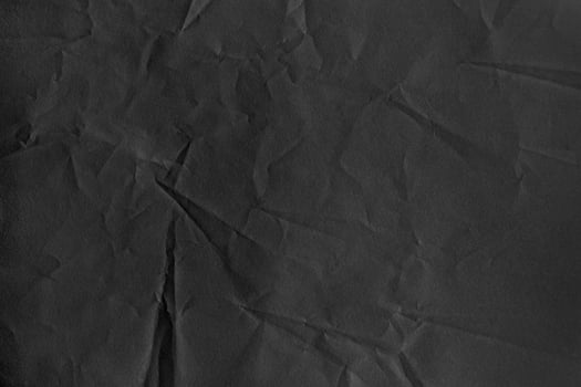 Black Textured Ragged Crumpled Paper Background photo