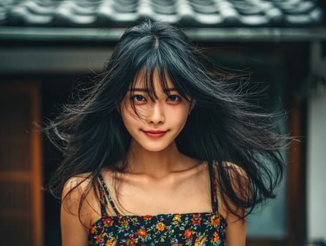 Portrait of attractive young asian woman with flowing black hair photo