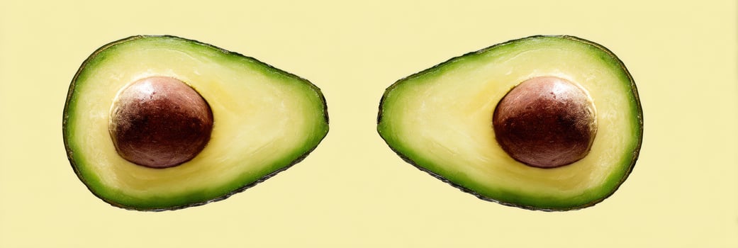 Mirrored Avocado Halves With a Clean Background Showcasing Vibrant Colors and Intriguing Symmetry photo